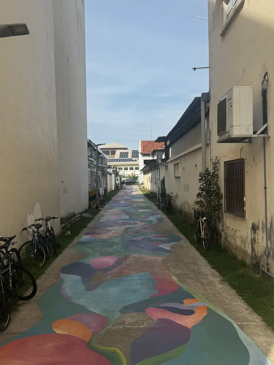 A colourful painted heritage lane between traditional buildings in Singapore